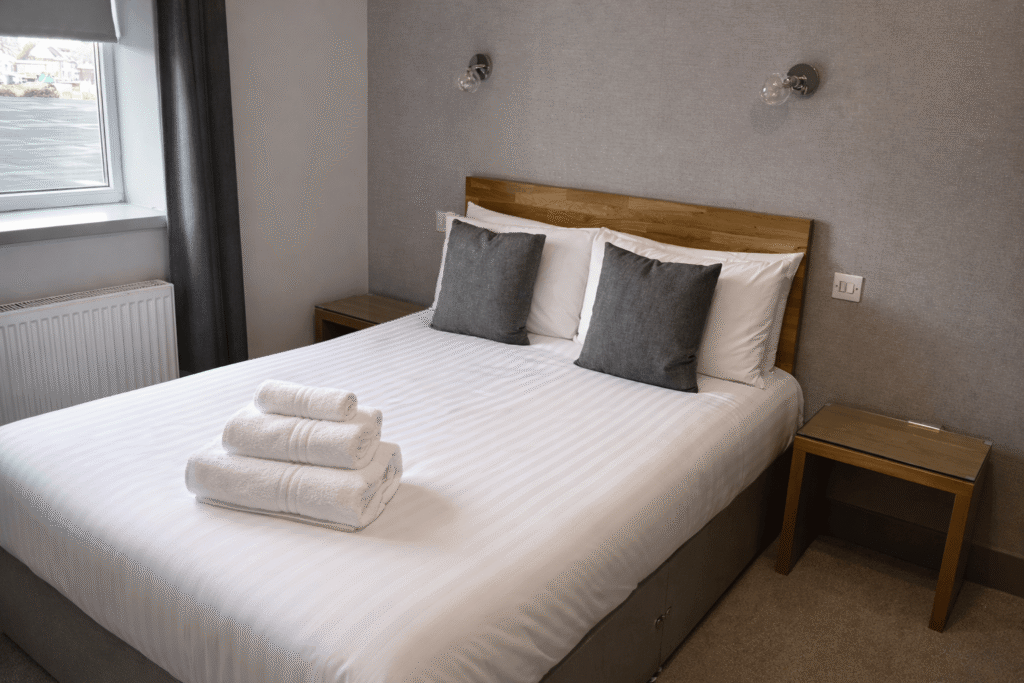 Family suite at Valley Hotel Anglesey with spacious double bed and modern décor