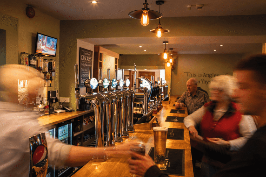 Restaurant and bar at Valley Hotel in Anglesey with guests enjoying drinks