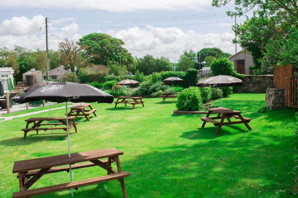 Large garden seating area at Valley Hotel in Valley near Holyhead