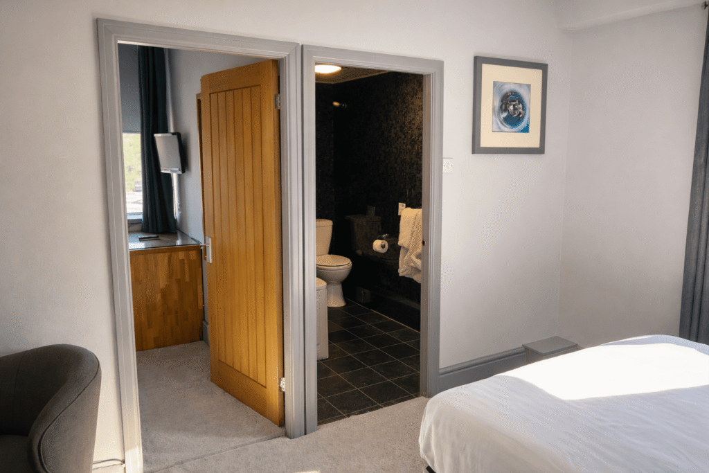 Family suite bedroom with en-suite bathroom at Valley Hotel Anglesey