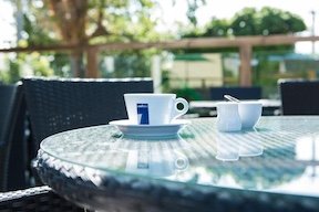 Outdoor terrace seating with coffee at Valley Hotel Anglesey