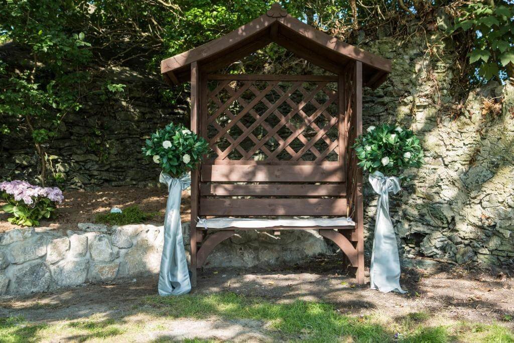 Outdoor wedding ceremony setup at Valley Hotel Anglesey garden